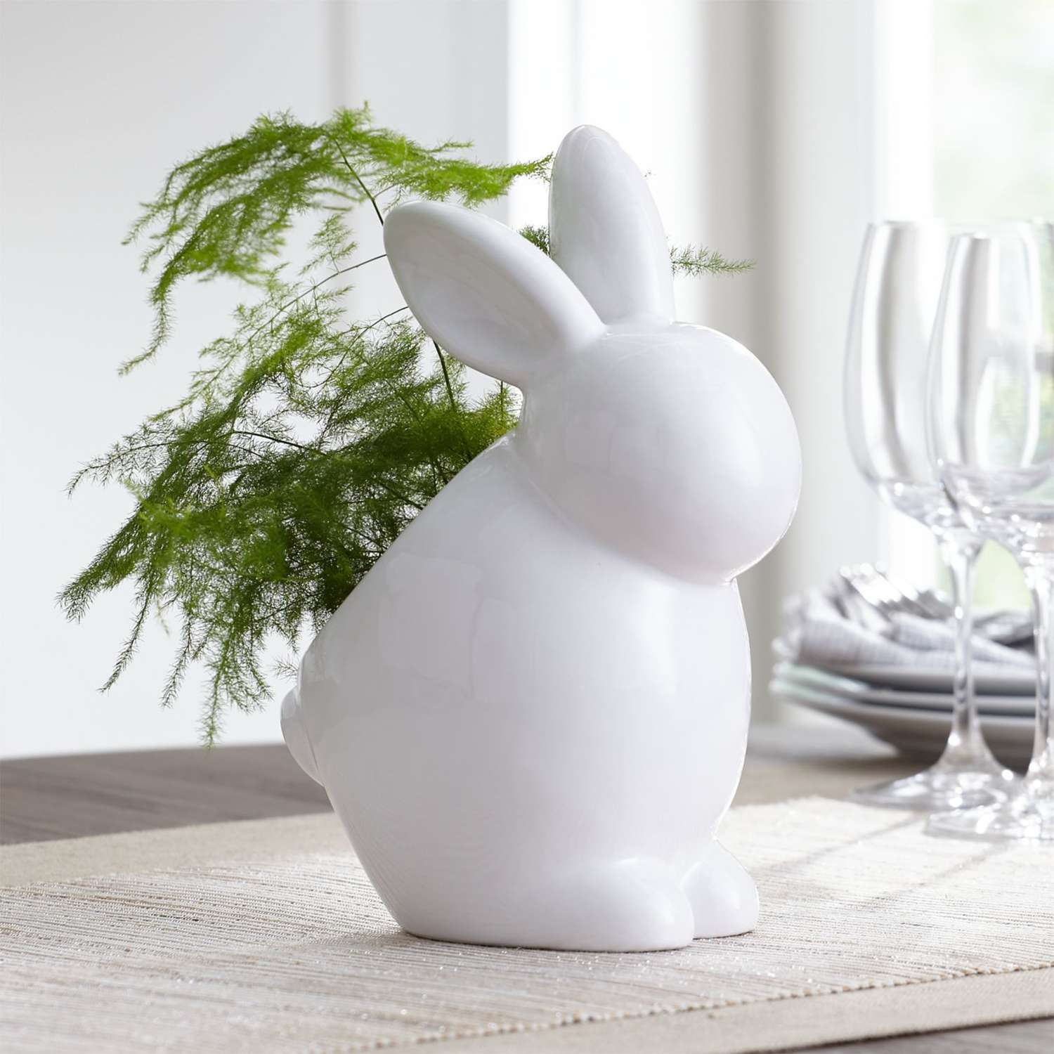 white ceramic bunny shaped planter with indoor plant