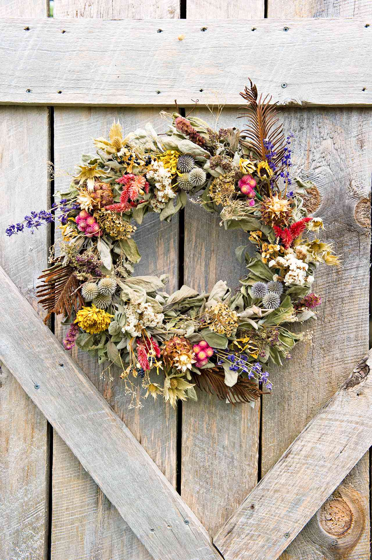 floral wreath hanging on barn door