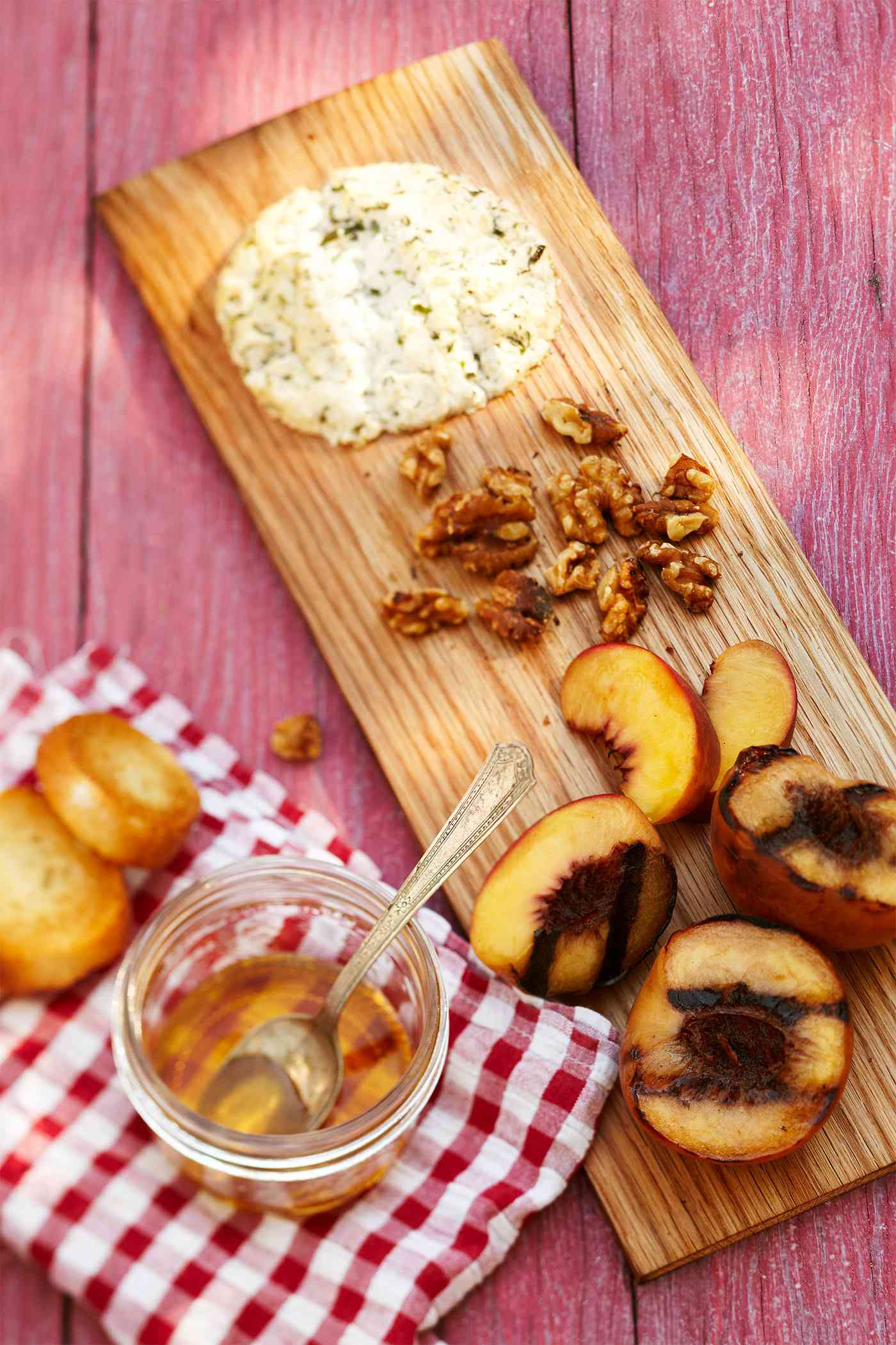 Plank-Smoked Peaches and Goat Cheese on wooden plank