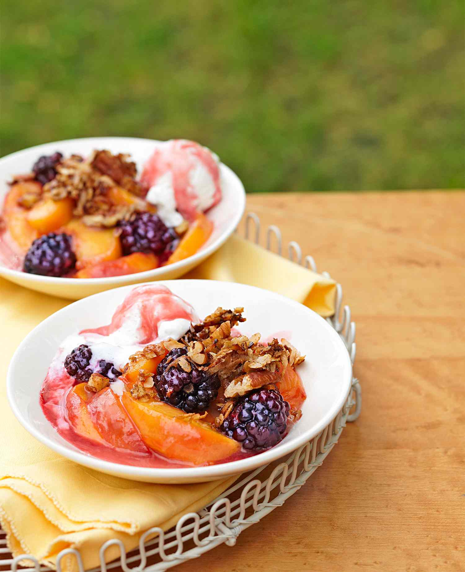 two dishes of Stovetop Peach-Blackberry Crisp