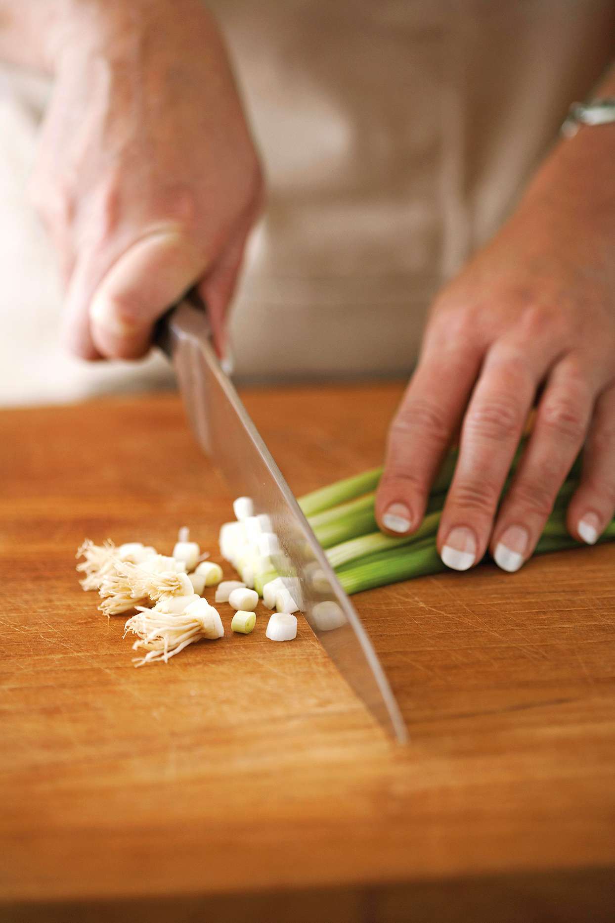 slicing green onions with knife