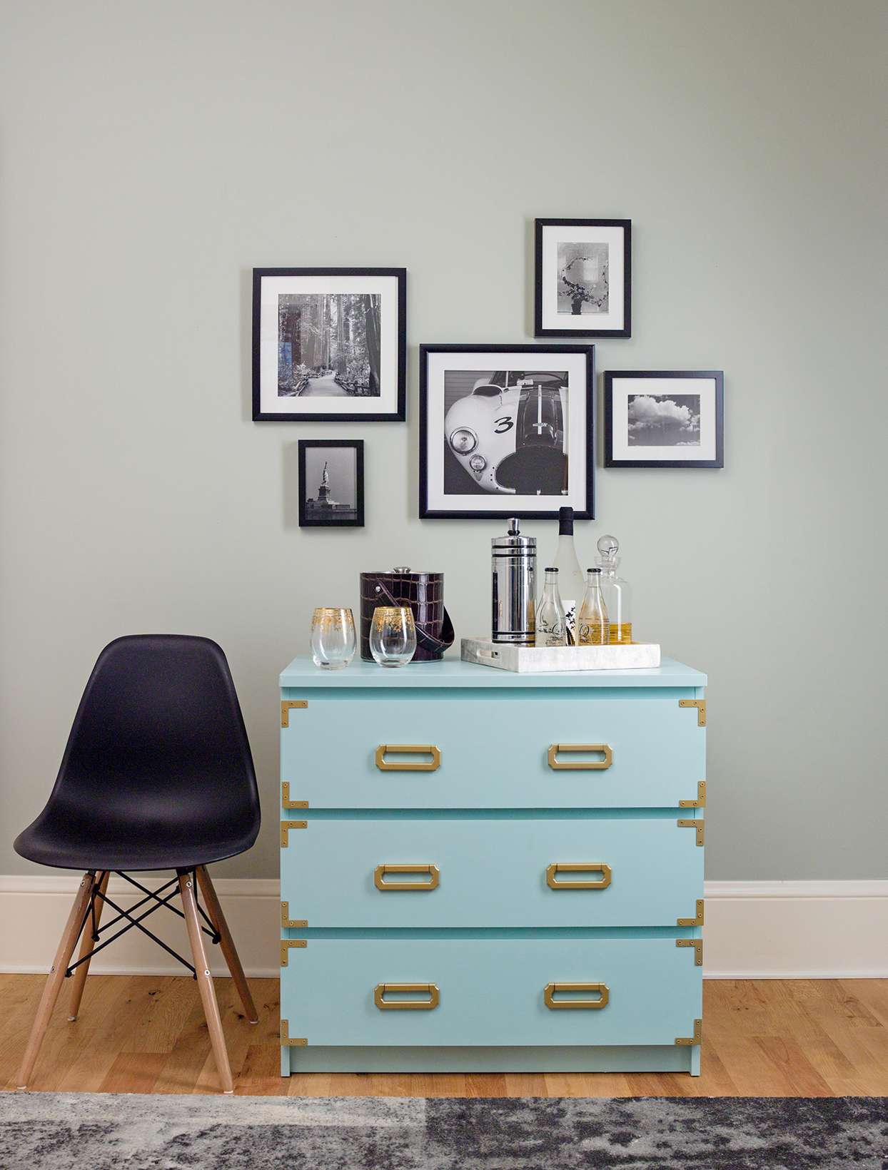 light blue dresser with gold accents in gray room