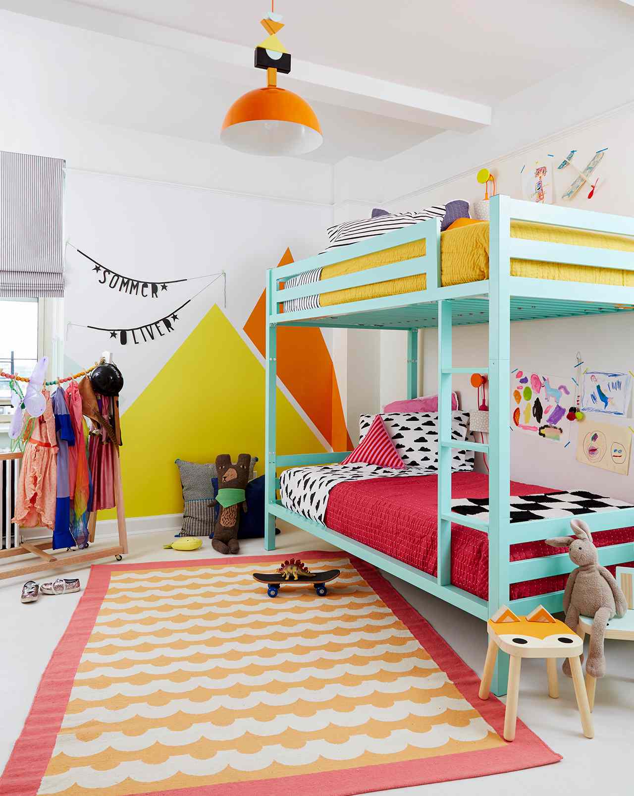 bright modern kids room with blue bunk beds