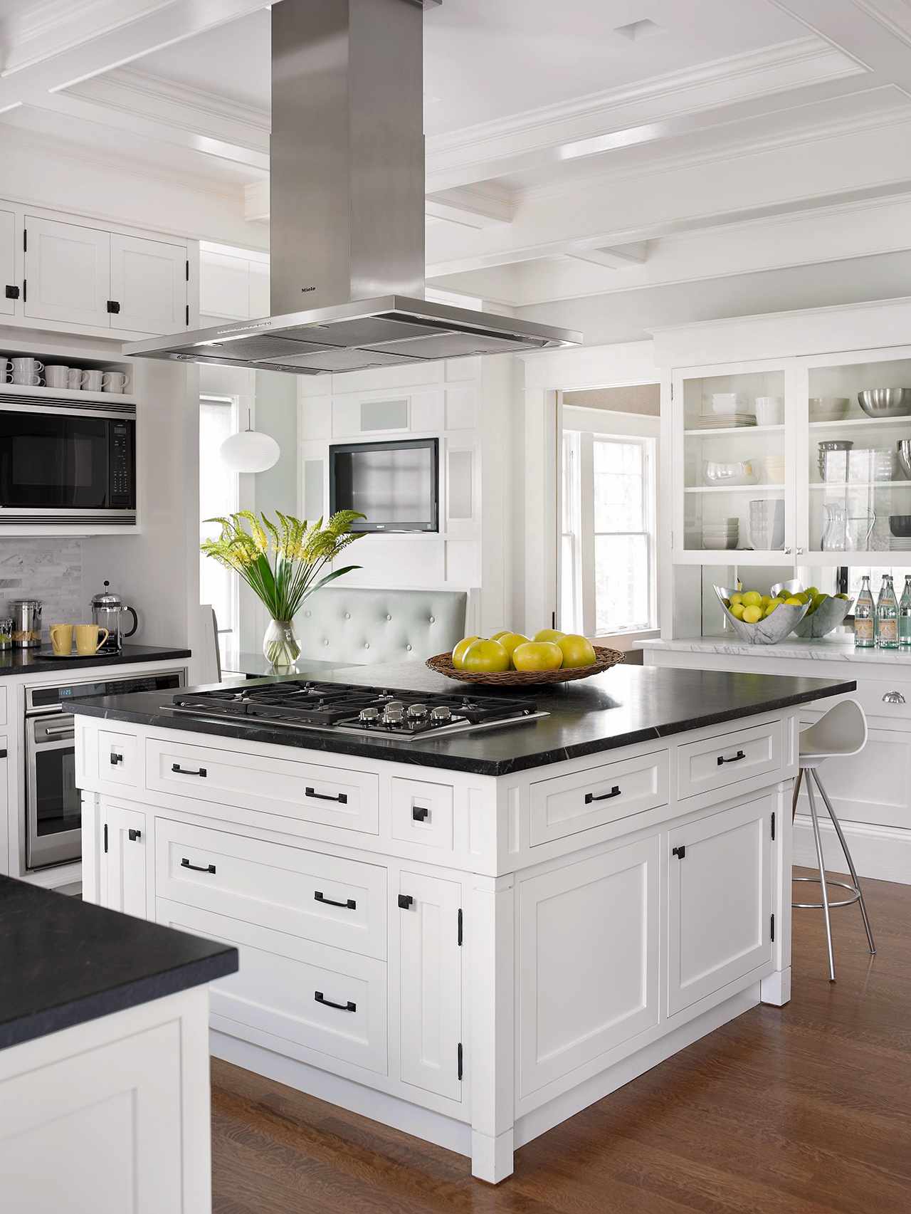 white kitchen with large black countertop island