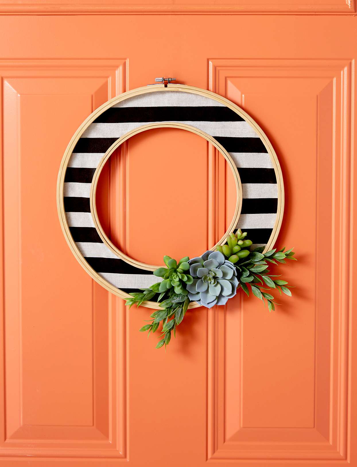 Black white striped wreath orange door