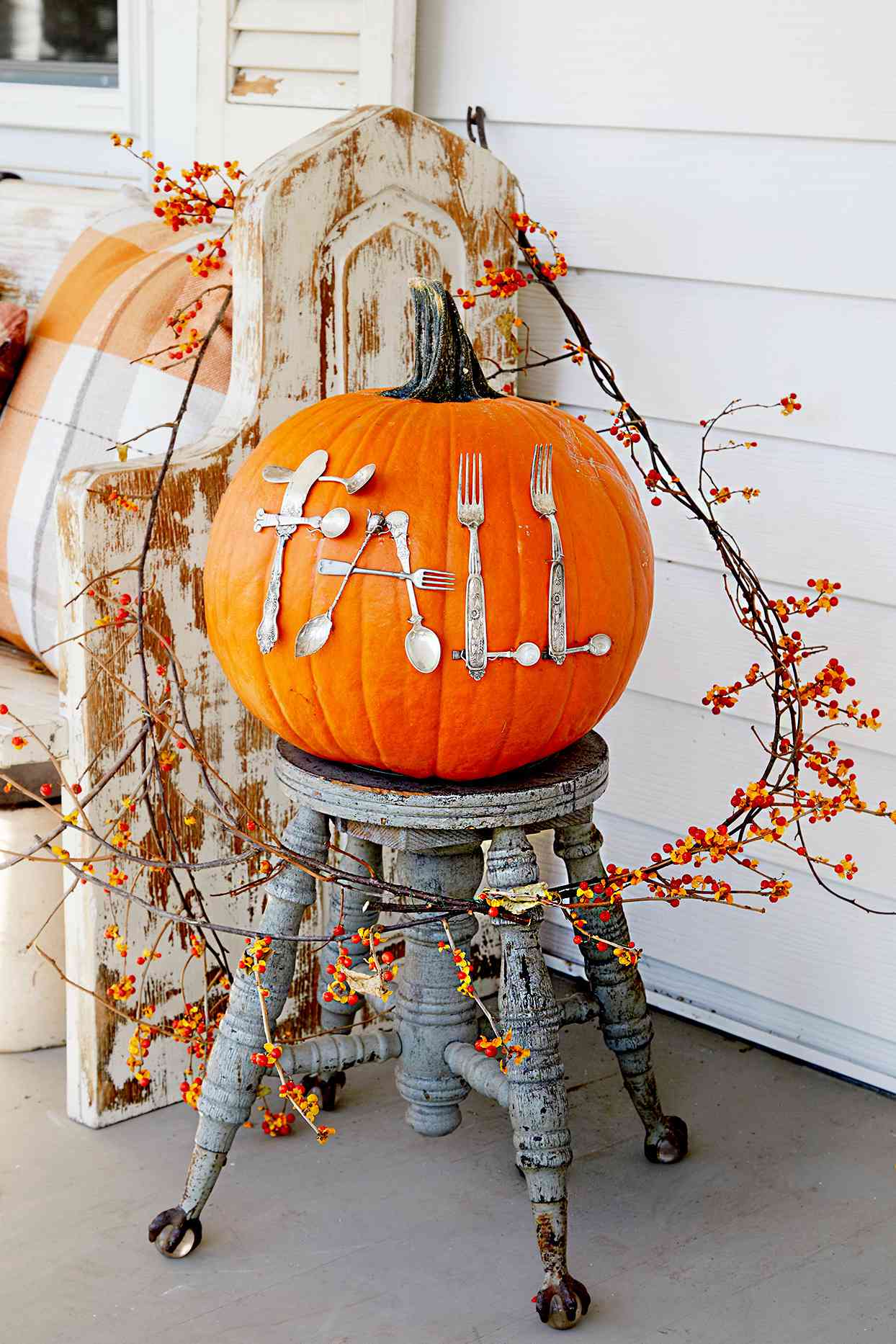 Pumpkin with "Fall" spelled with silverware
