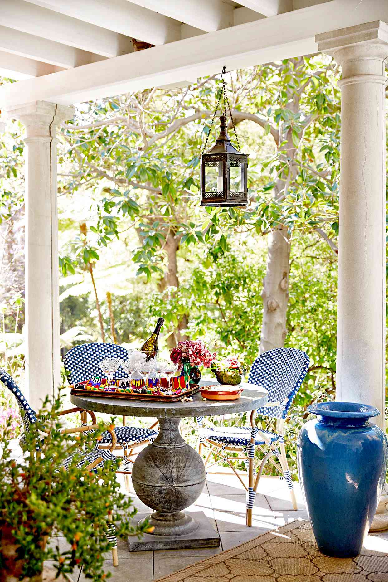 Porch with table, chairs, blue vase