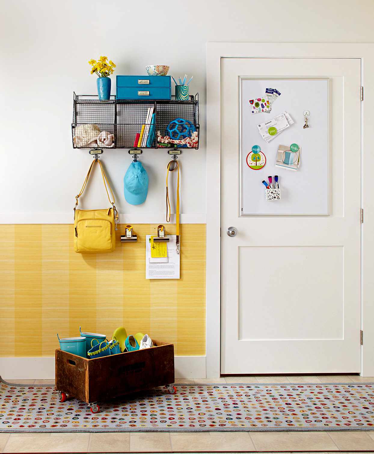 Entryway with yellow wall and hanging organizer