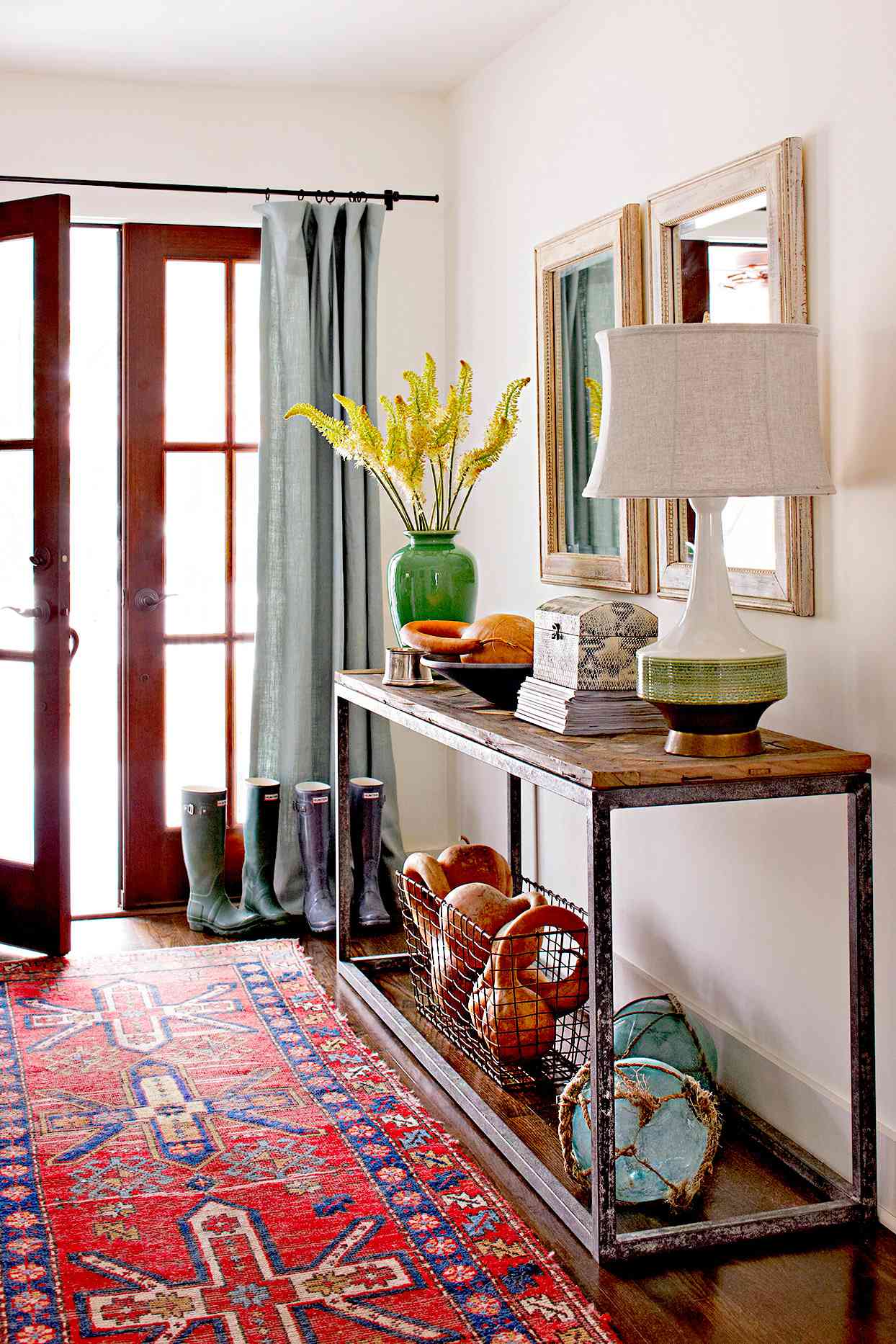 Entryway with table filled with d&eacute;cor