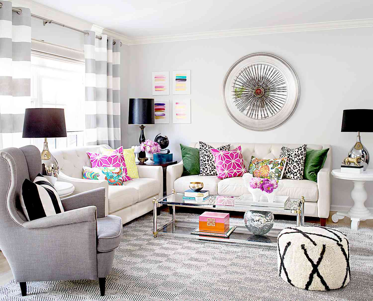 Living room with colorful pillows and large wall art