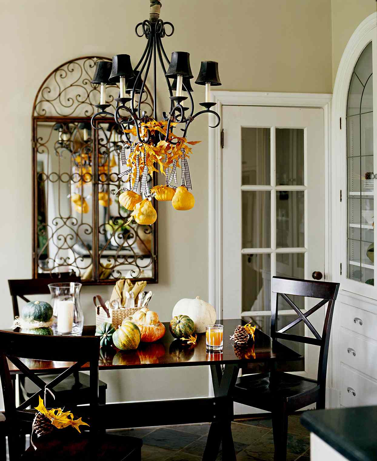 Dining room with wood furniture and pumpkin and pear decor