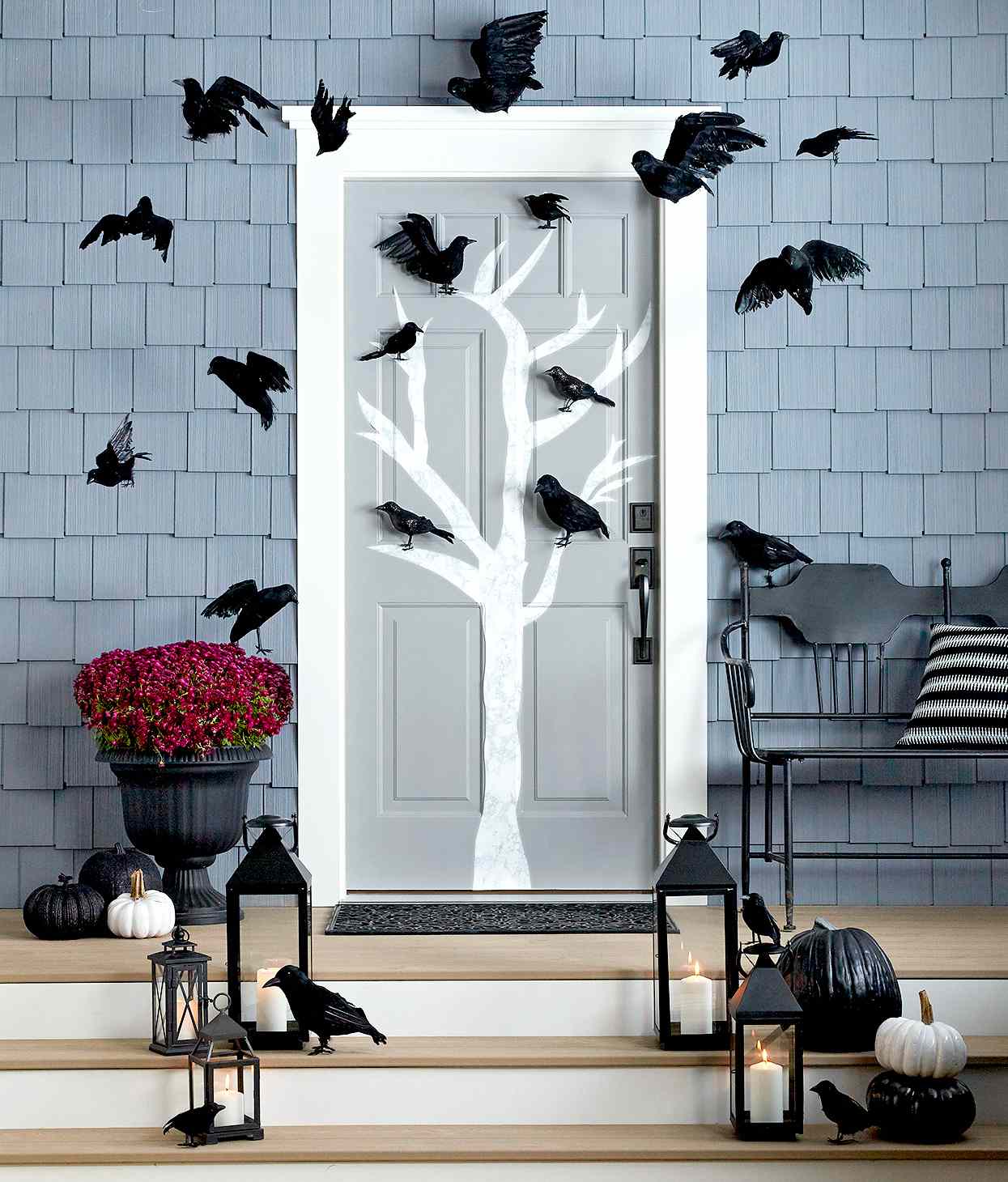 front porch with tree and ravens