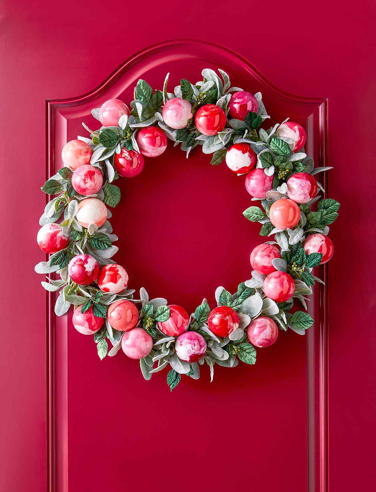 red door with red ornaments and greenery