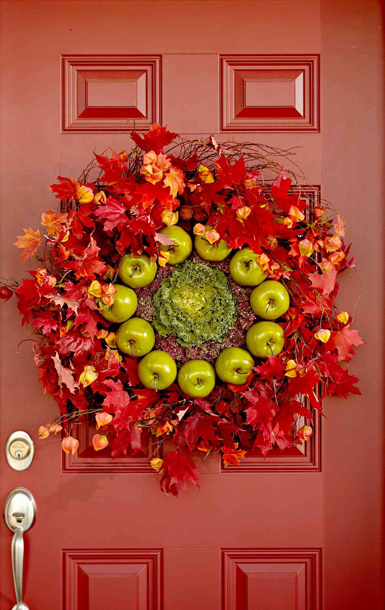 Front door wreath made of leaves and apples