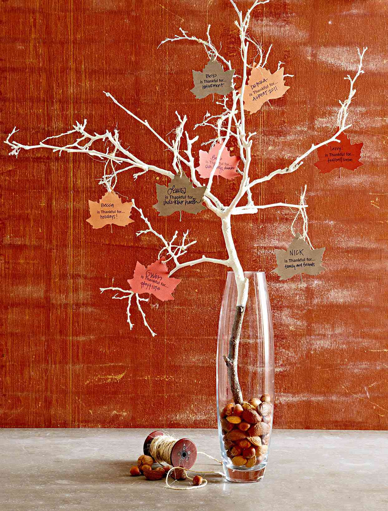 Branch in vase with leaves with messages