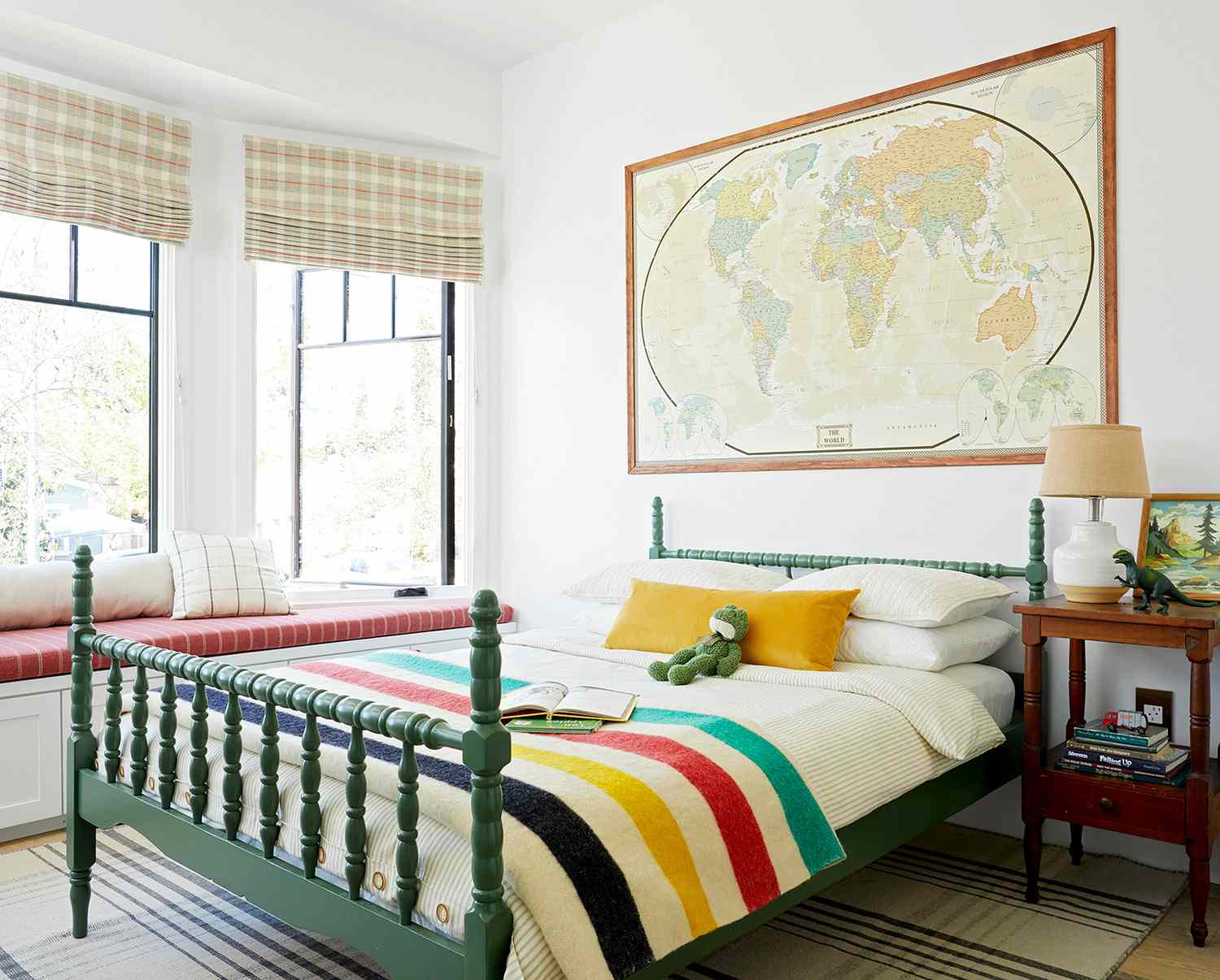 child's bedroom with large map above bed