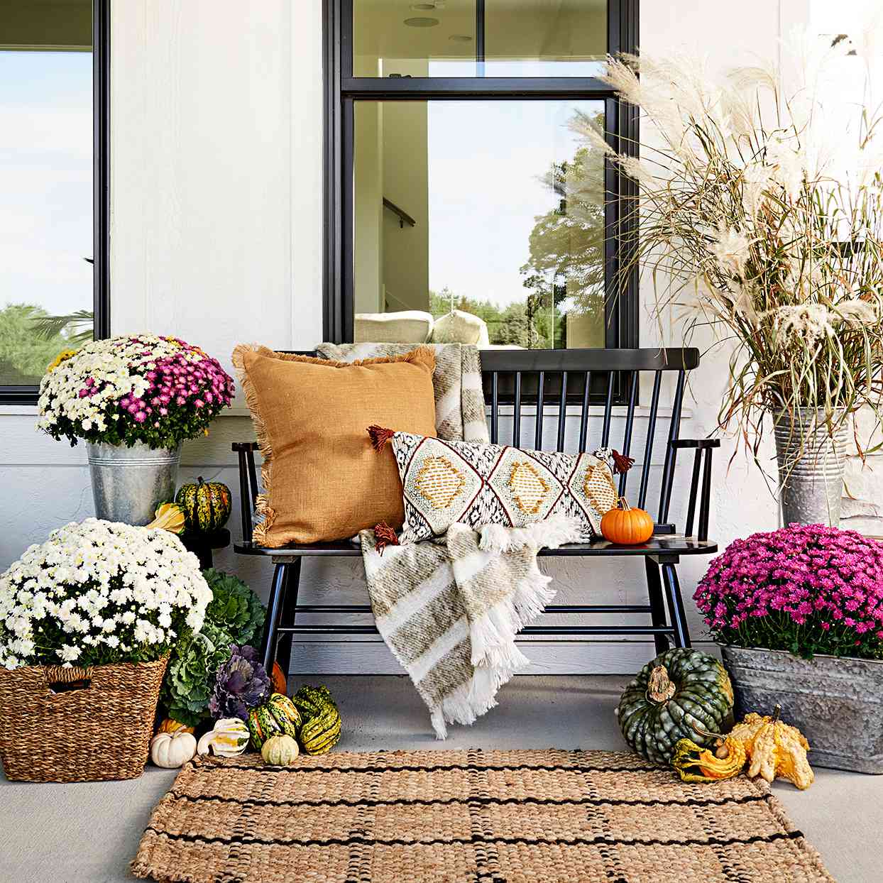 Front porch with wooden seating and flowers