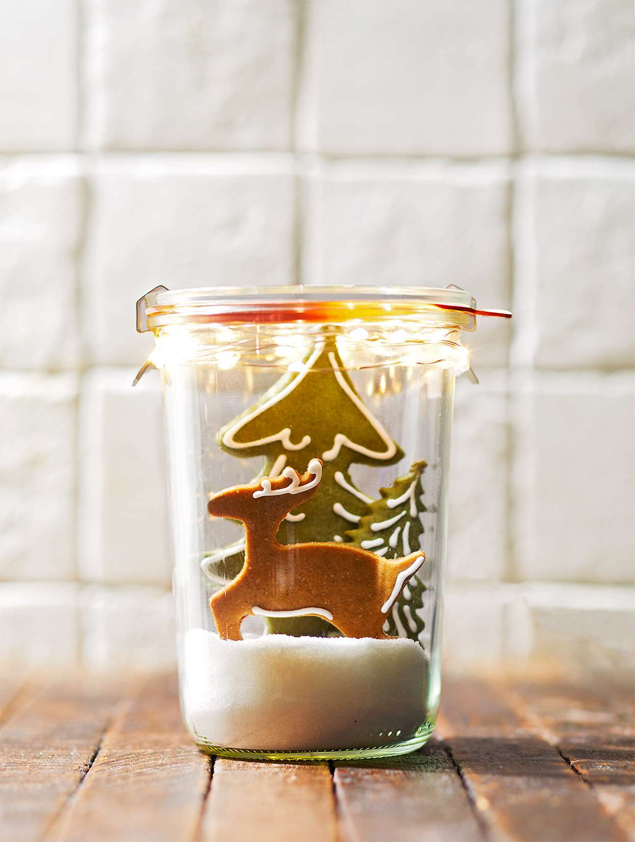 Mason jar with gingerbread deer and trees
