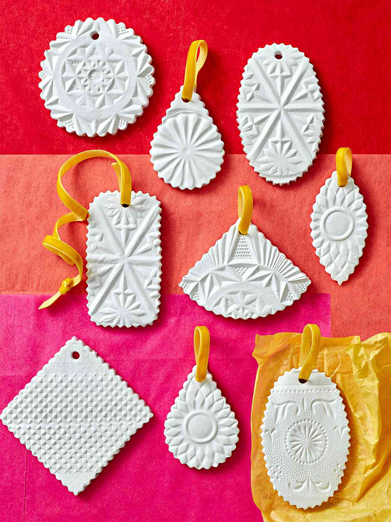 DIY white stamped clay ornaments bright velvet ribbon