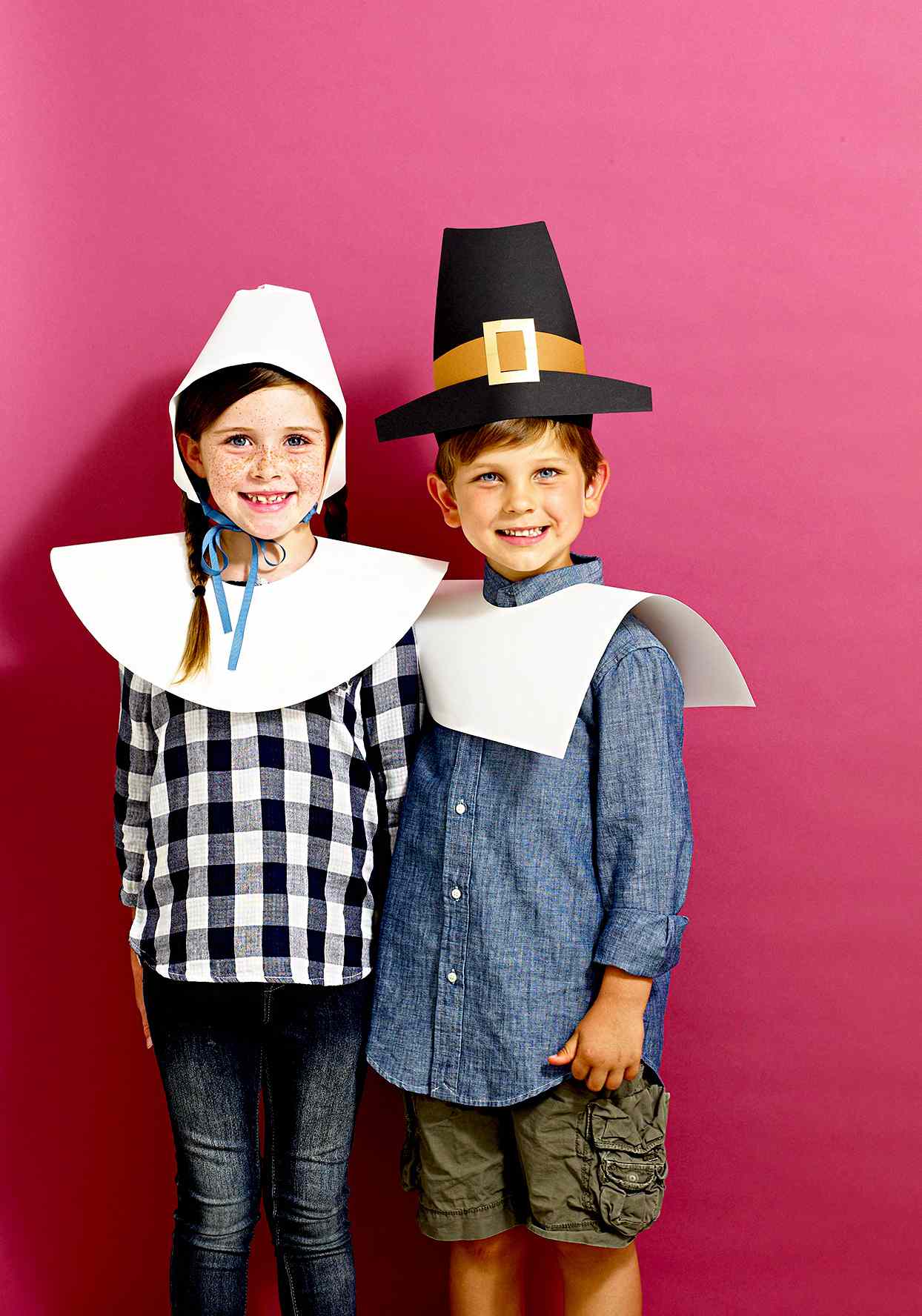 Two children wearing pilgrim craft costumes