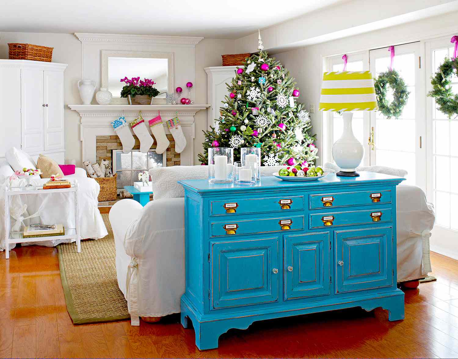 Living room with Christmas tree and blue cabinet