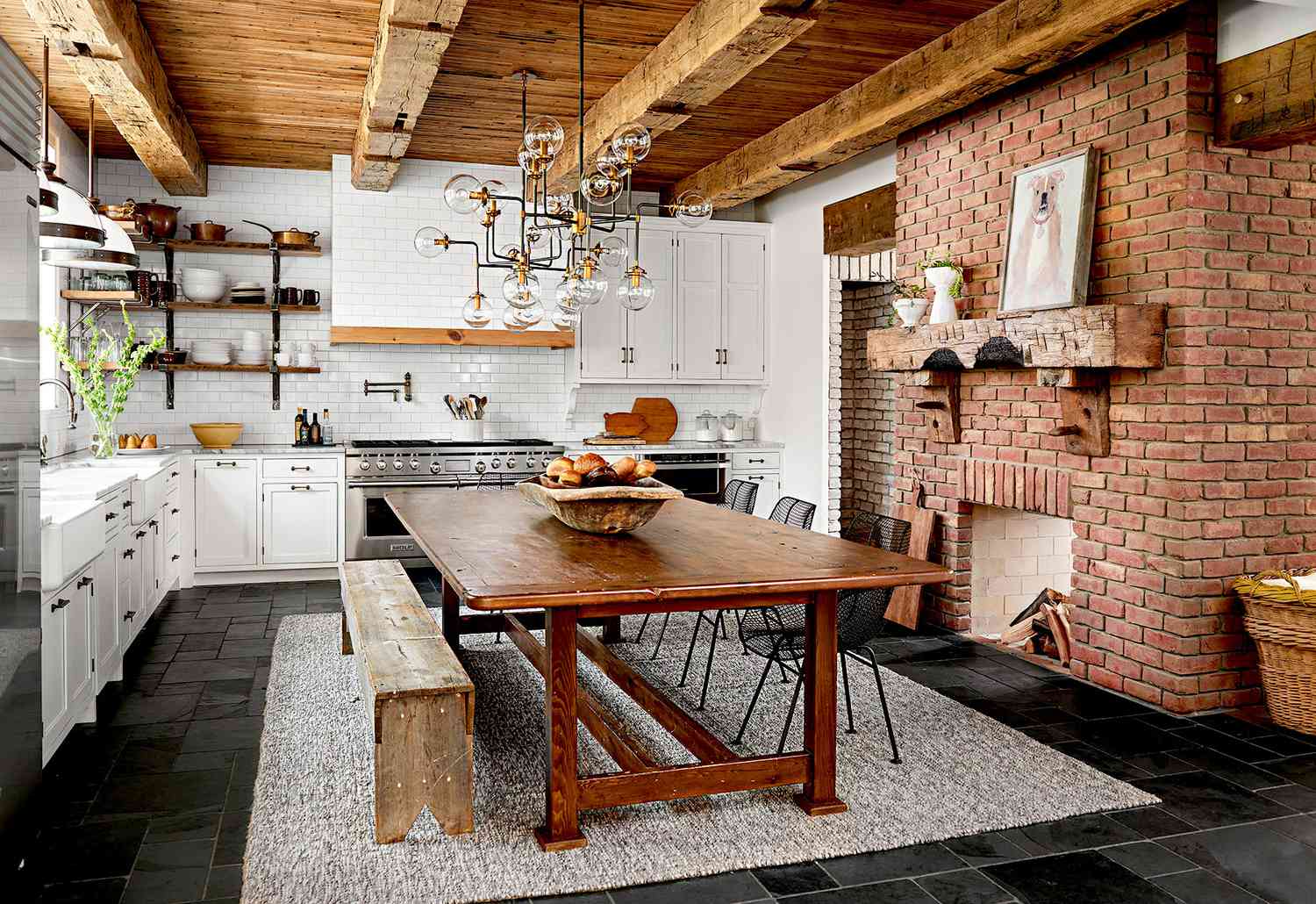 Kitchen with wooden table and brick fireplace