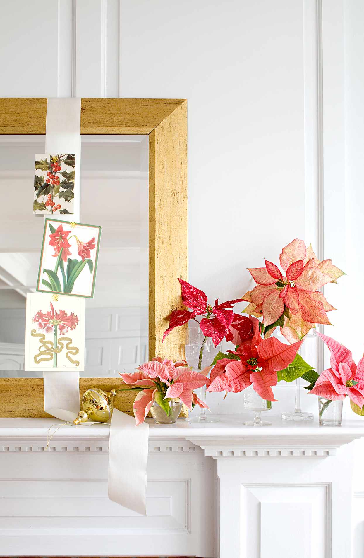 Mantel with poinsettias and mirror