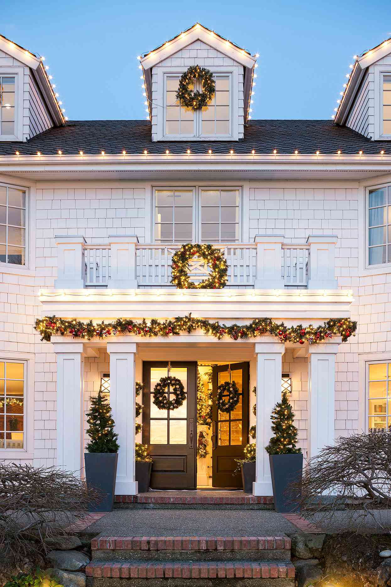 white house exterior with shakers, columns and Christmas decor