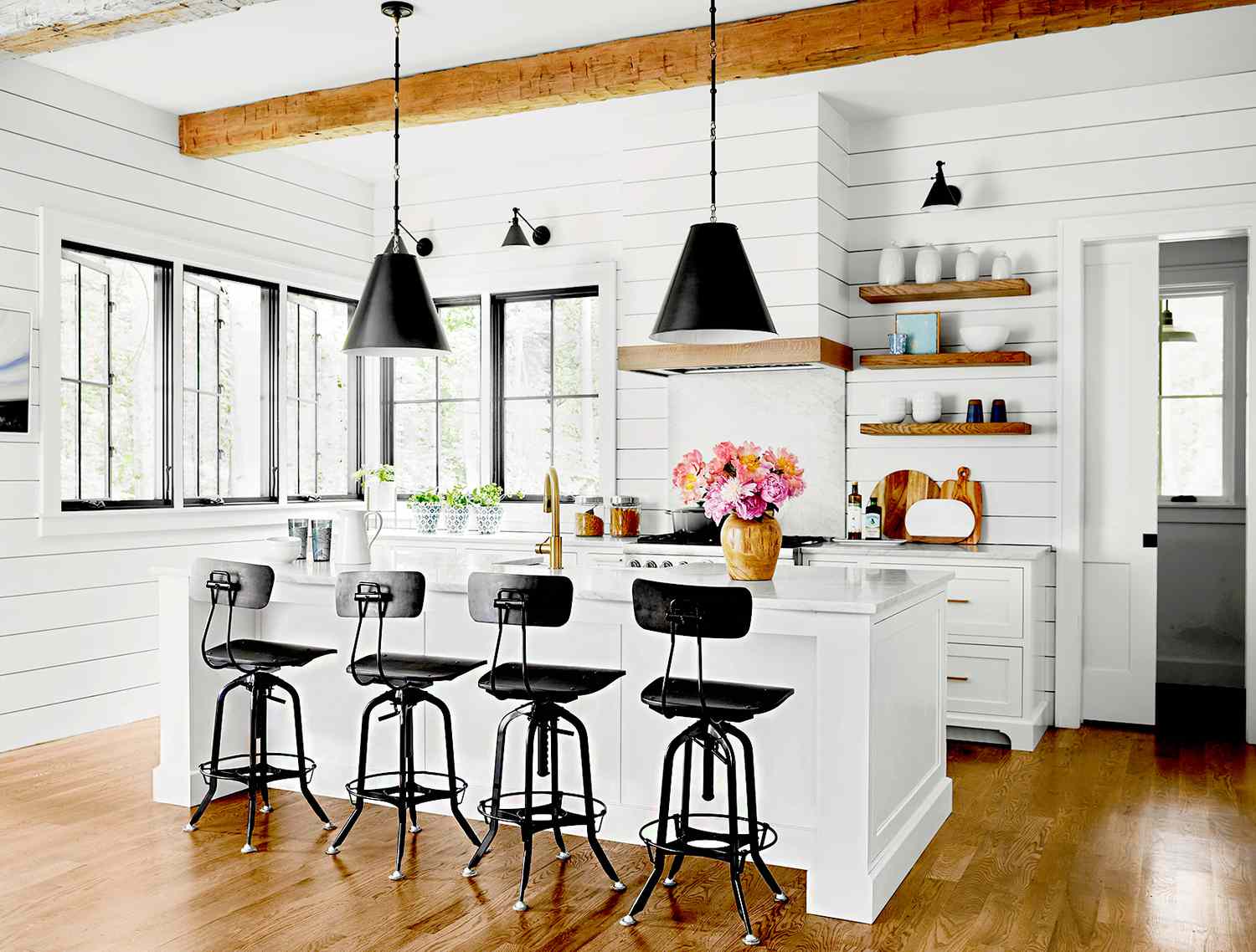 Modern farmhouse kitchens with bright white cabinets and a white marble countertop