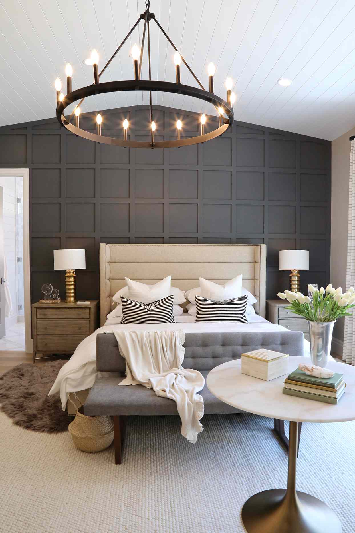 bedroom with dark gray accent wall