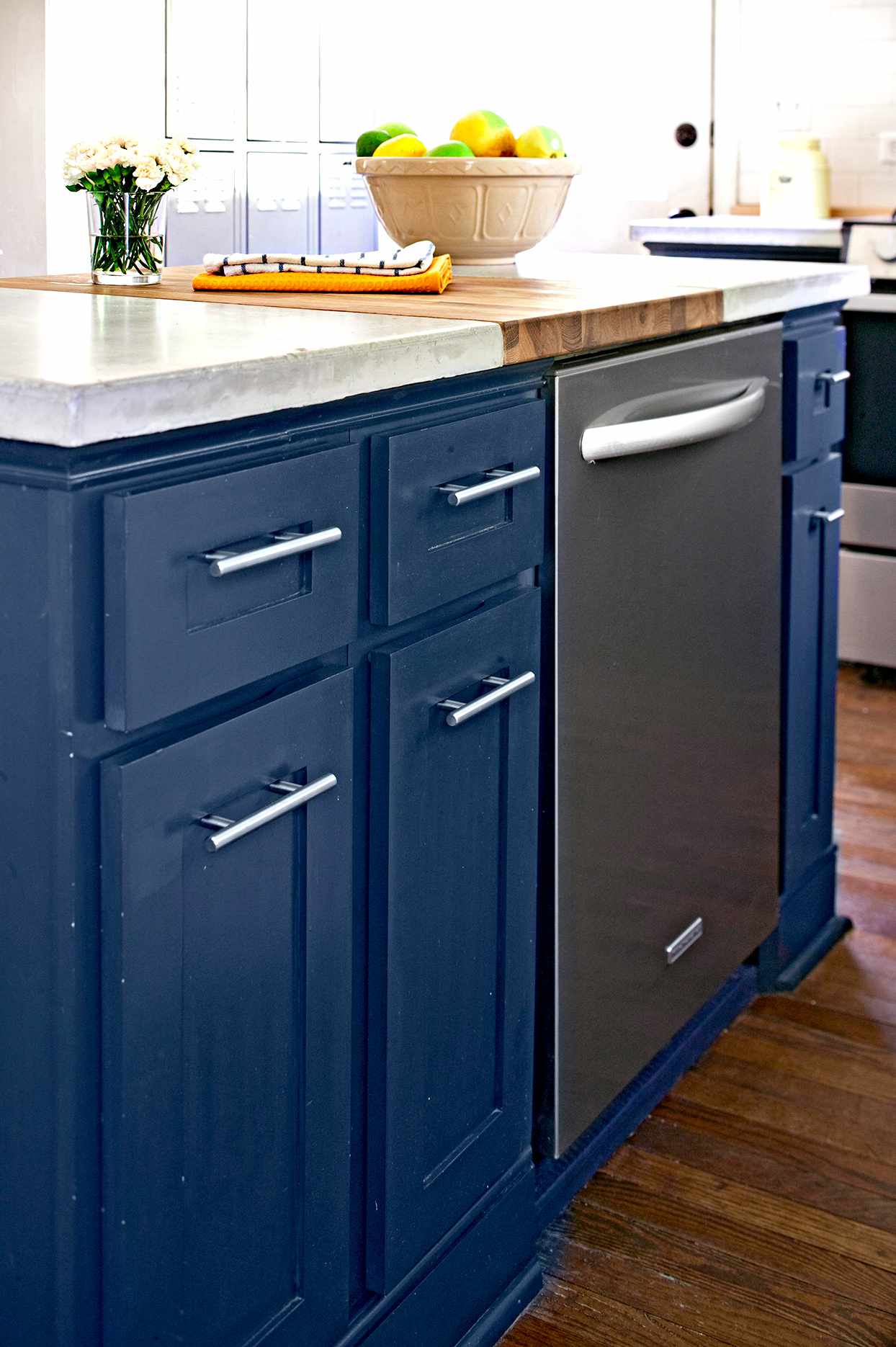Dark blue cabinets with dishwasher