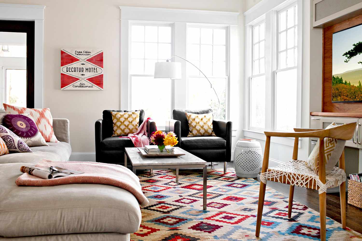 Living room with couches and patterned rug