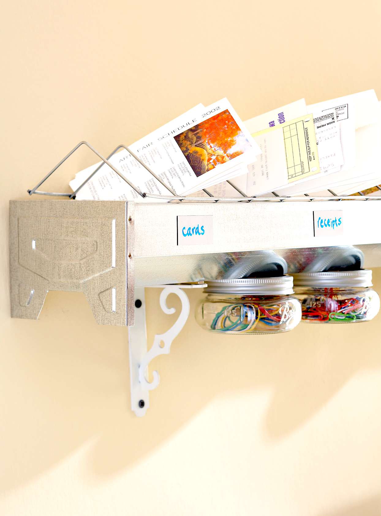 Metal hanging organizer with papers and other items