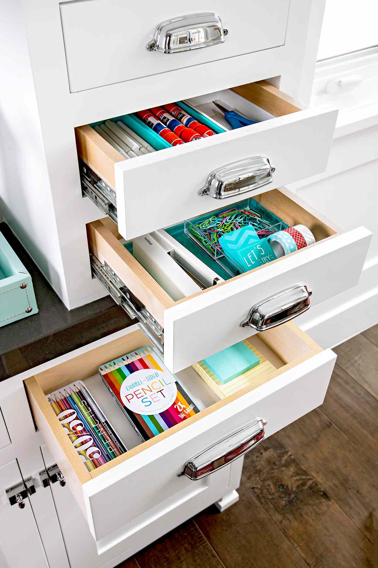Open drawers with organized supplies