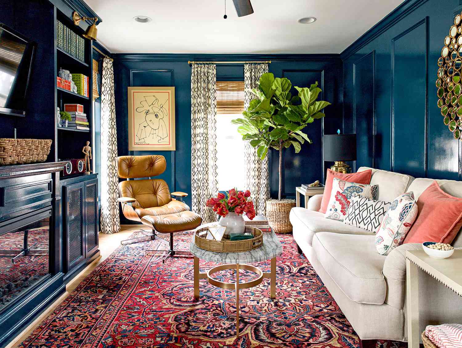 Living room with patterned rug and blue walls