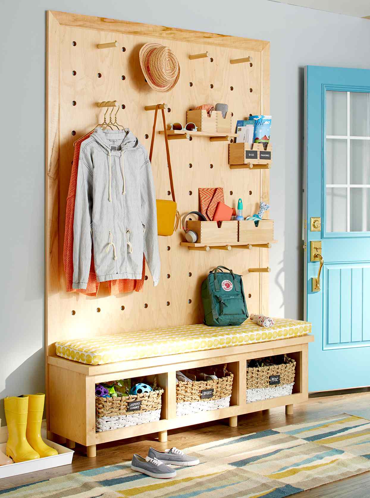 Pegboard holding items at front door