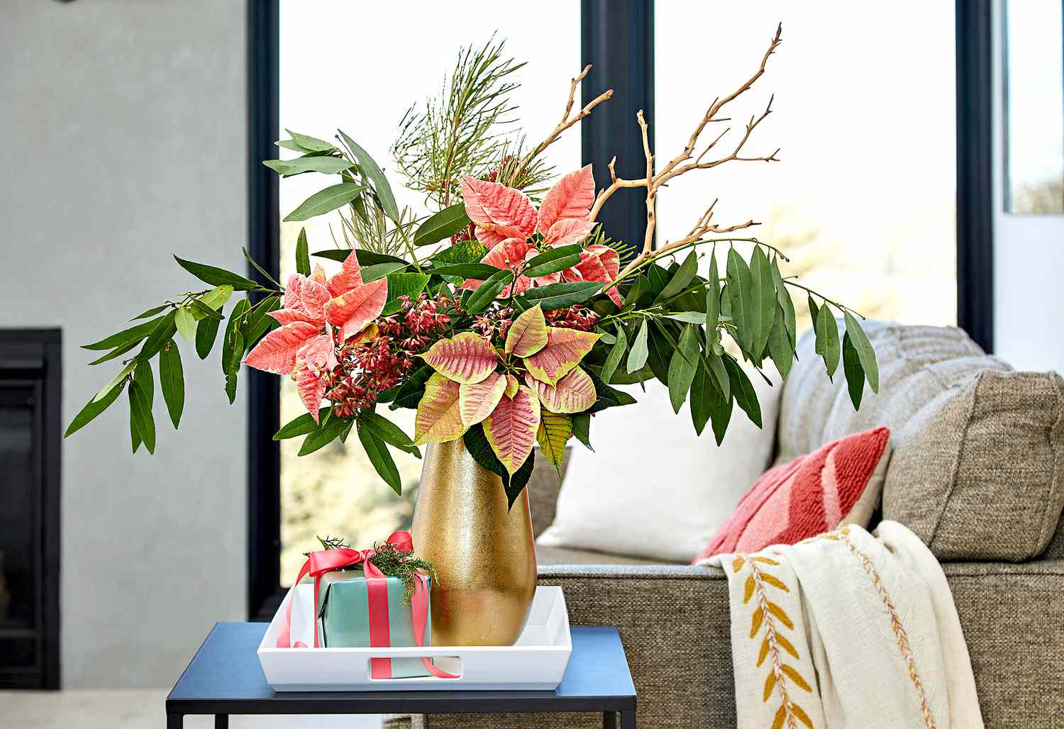Pink poinsettia in gold planter