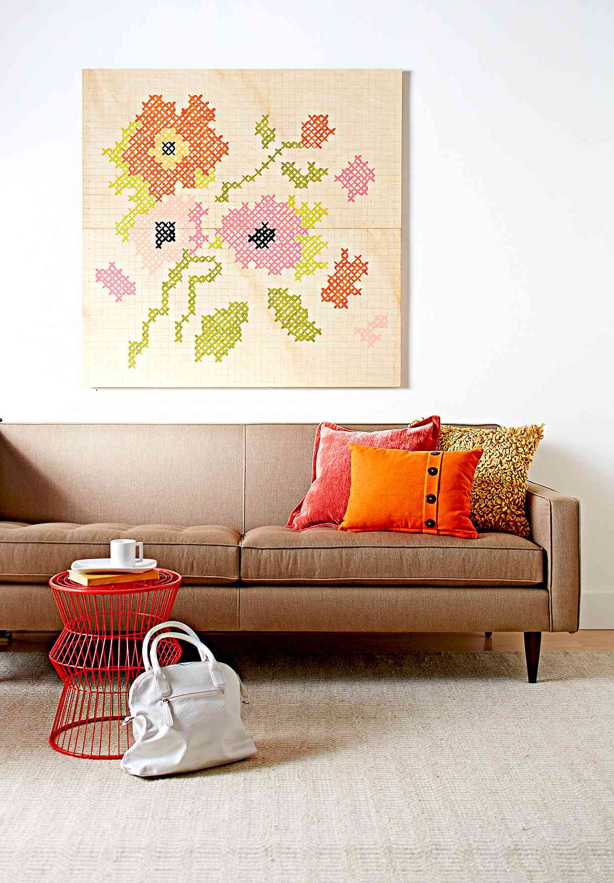 Seating area with embroidery wall art