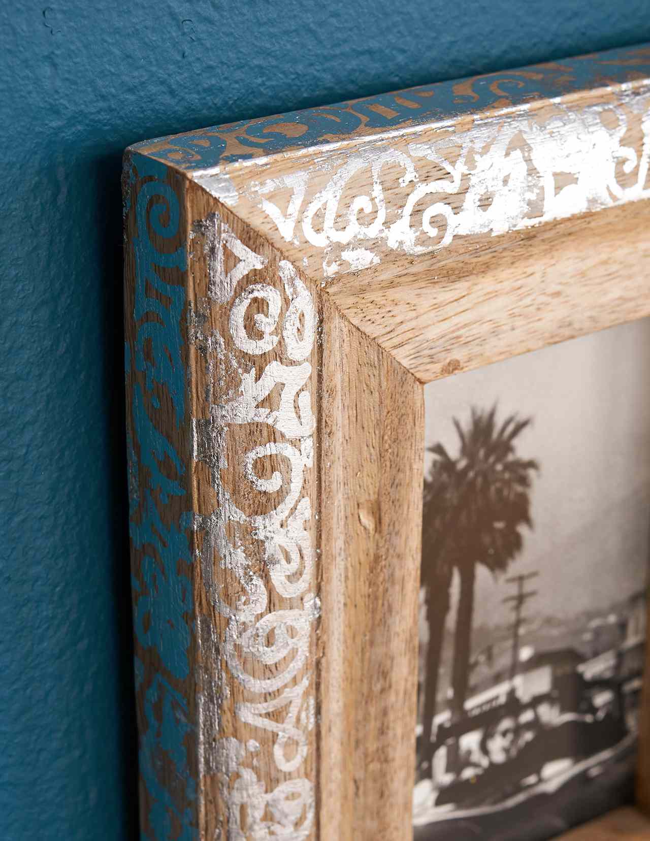 wood art frame with silver paint around edges