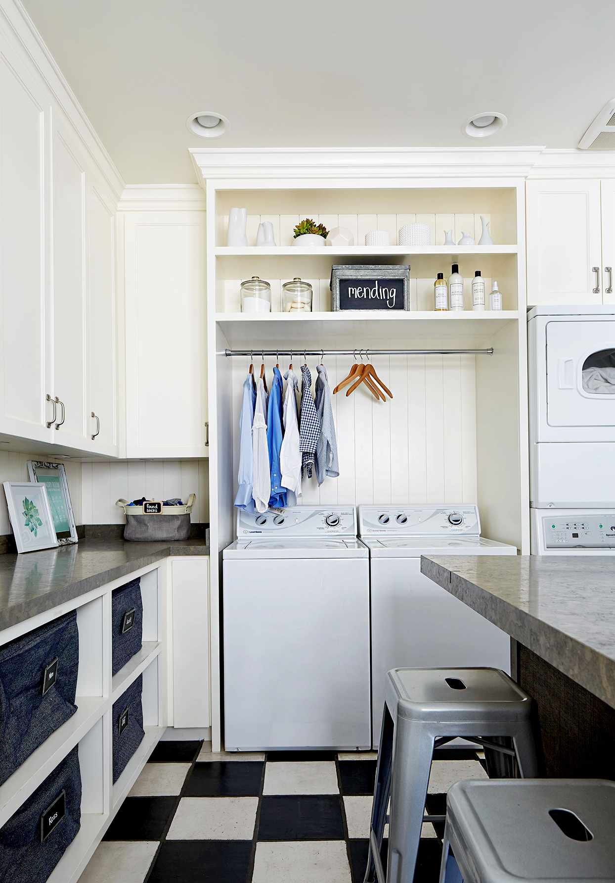 Laundry room with bin and clothes storage