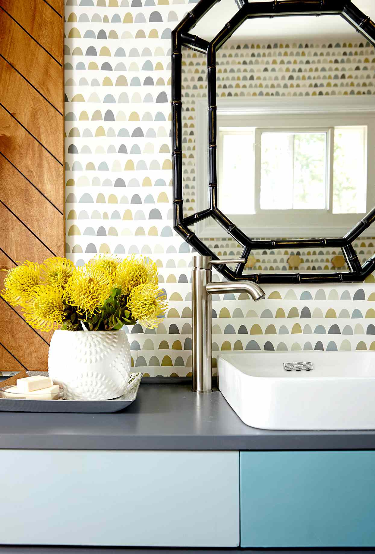 Bathroom sink with patterned wallpaper