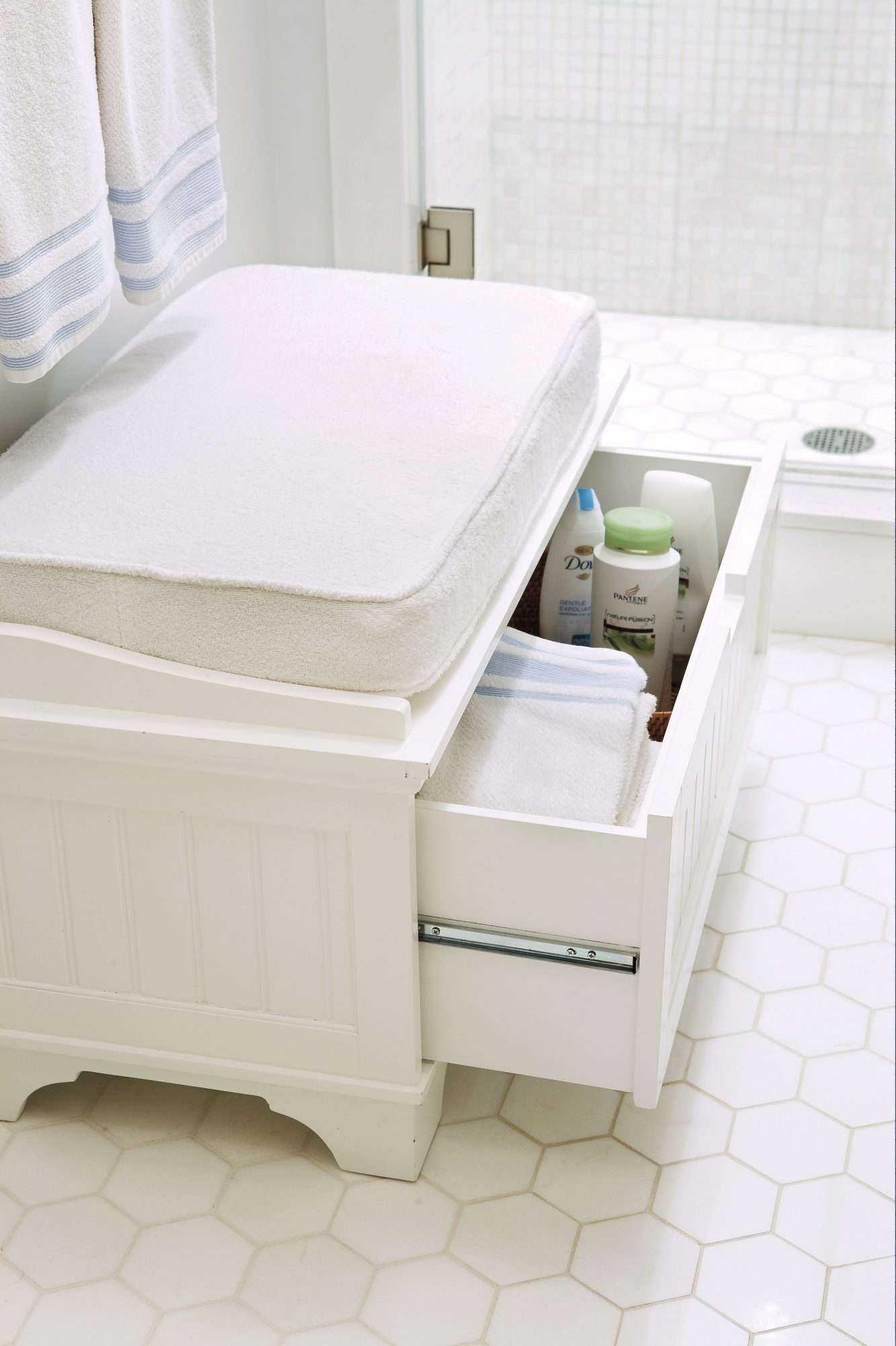 white bench with open drawer in bathroom