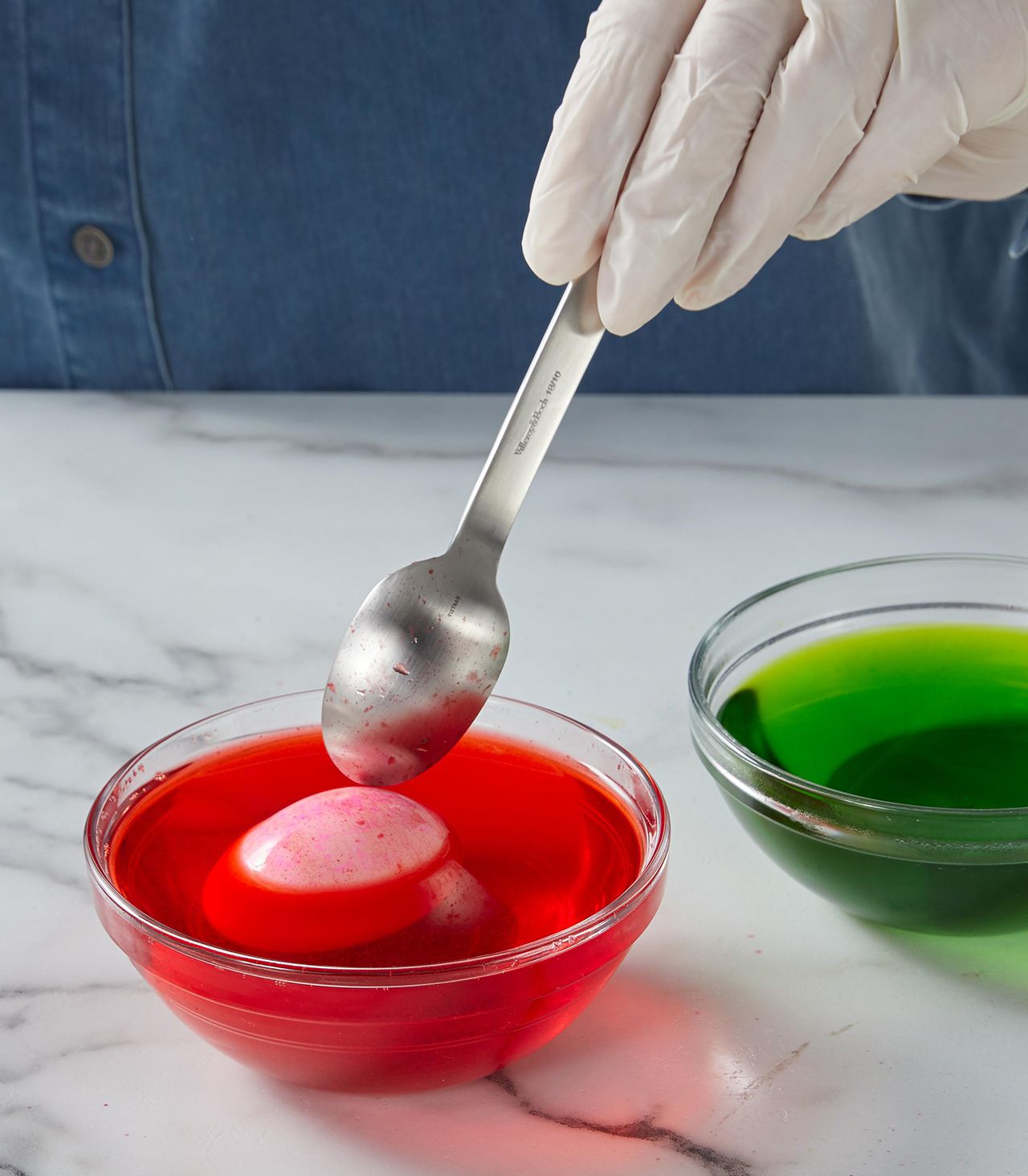 stirring egg in red color dye
