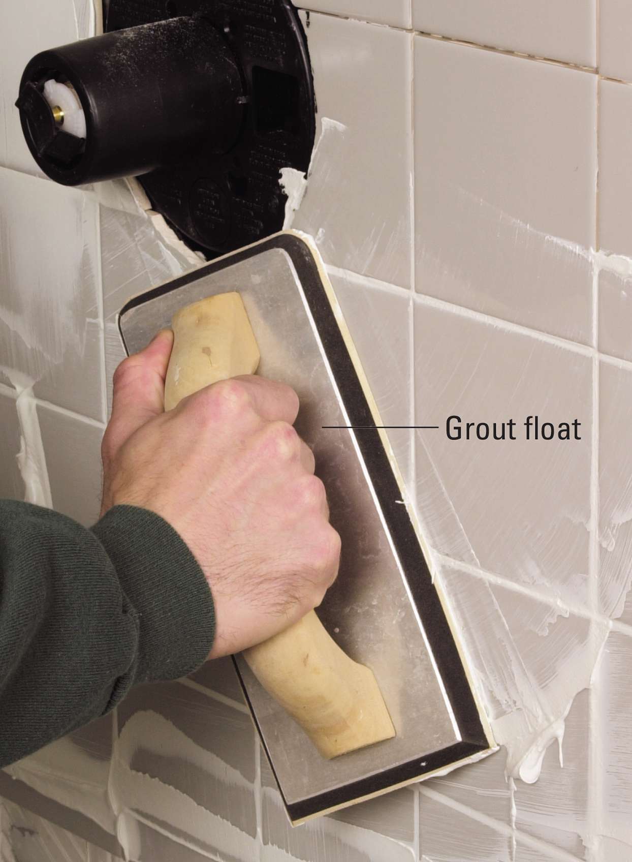 grout and caulk shower tiles