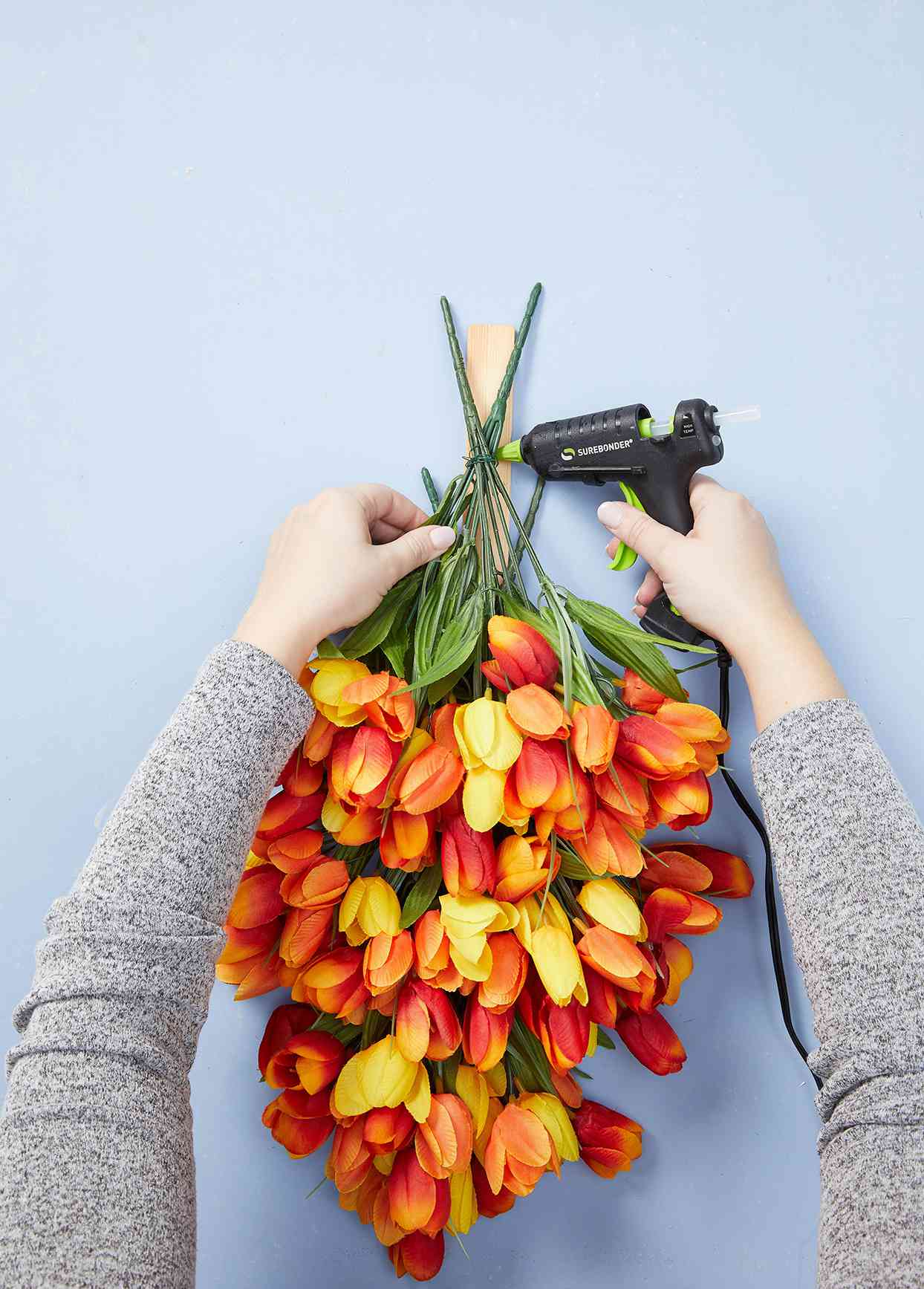 full bouquet of tulips superglued to wood