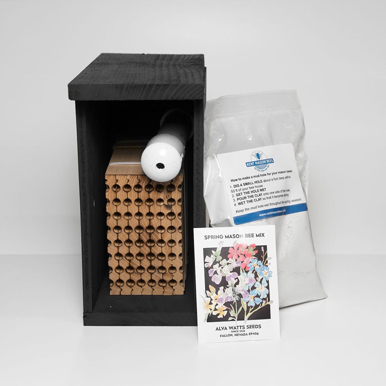 mason bee kit with house, nesting block, tube of bee cocoons, clay, and flower seeds