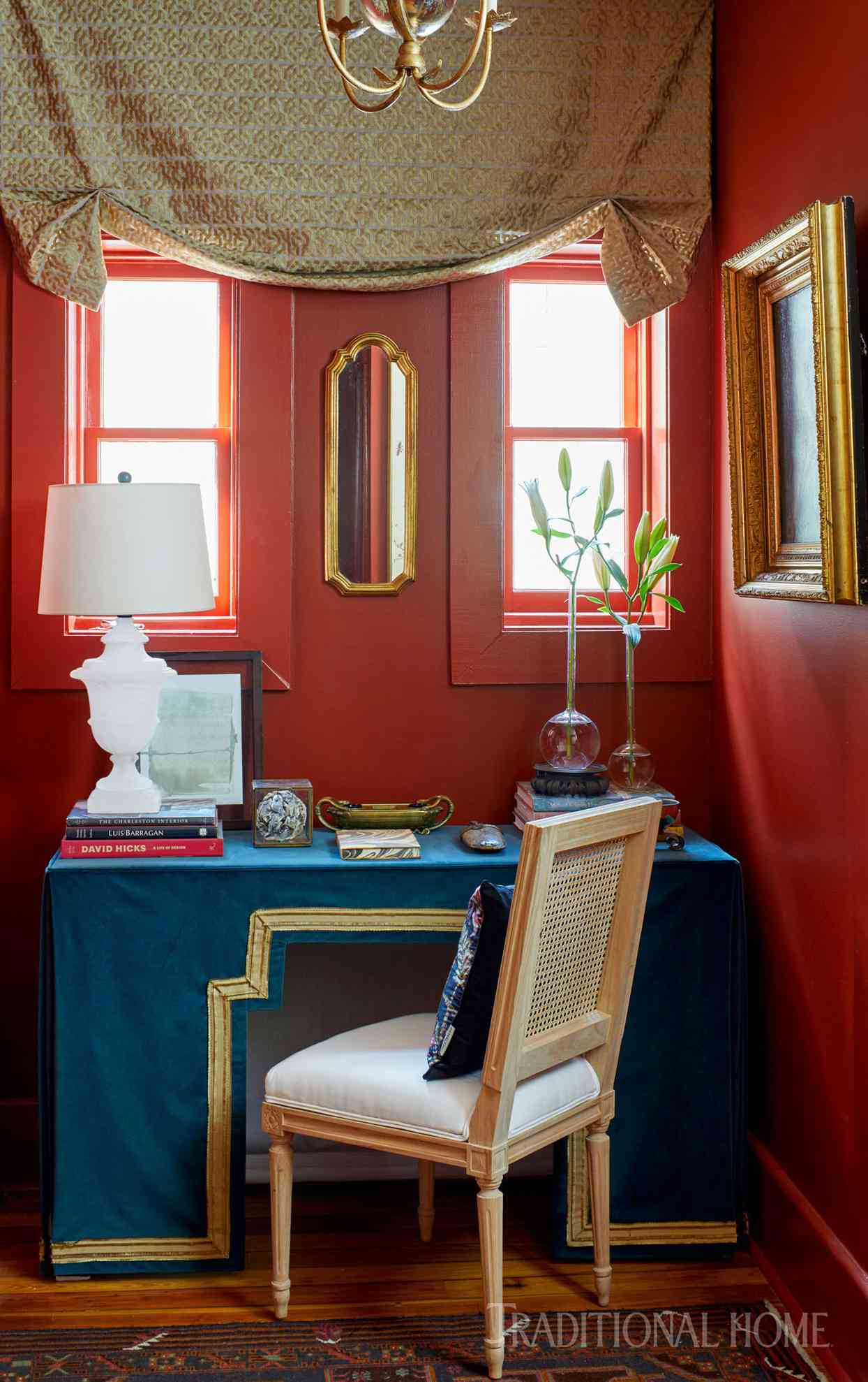 salon with red walls and blue desk
