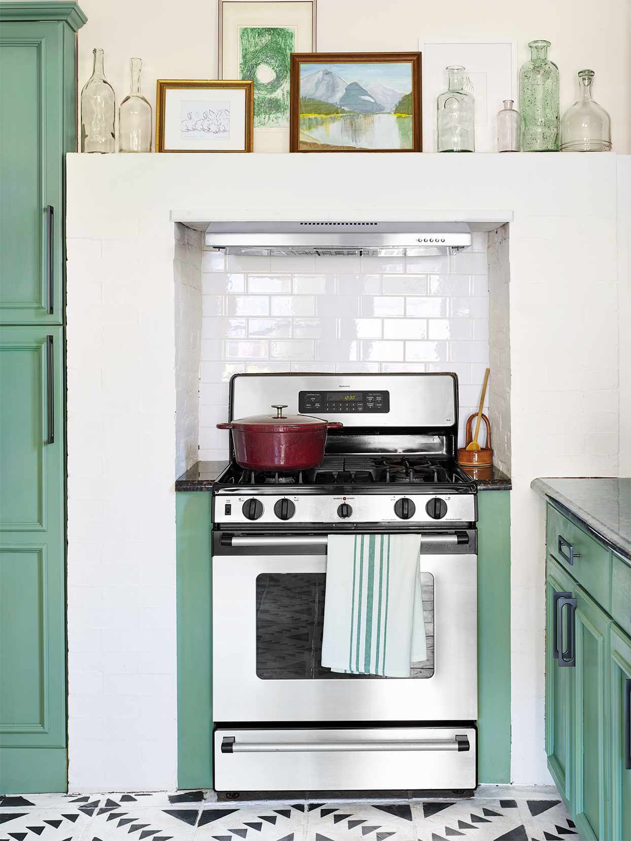 Stove surrounded by white and green wall