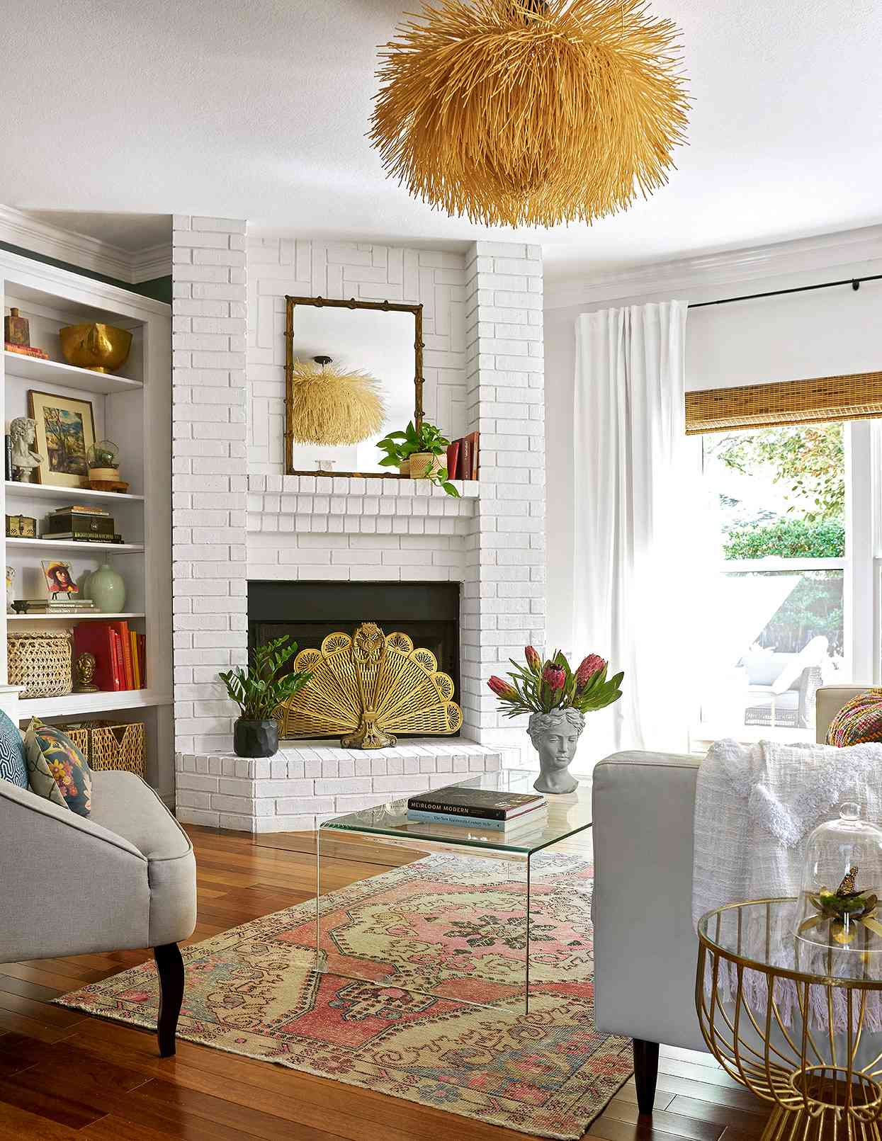bright retro living room with painted brick corner fireplace