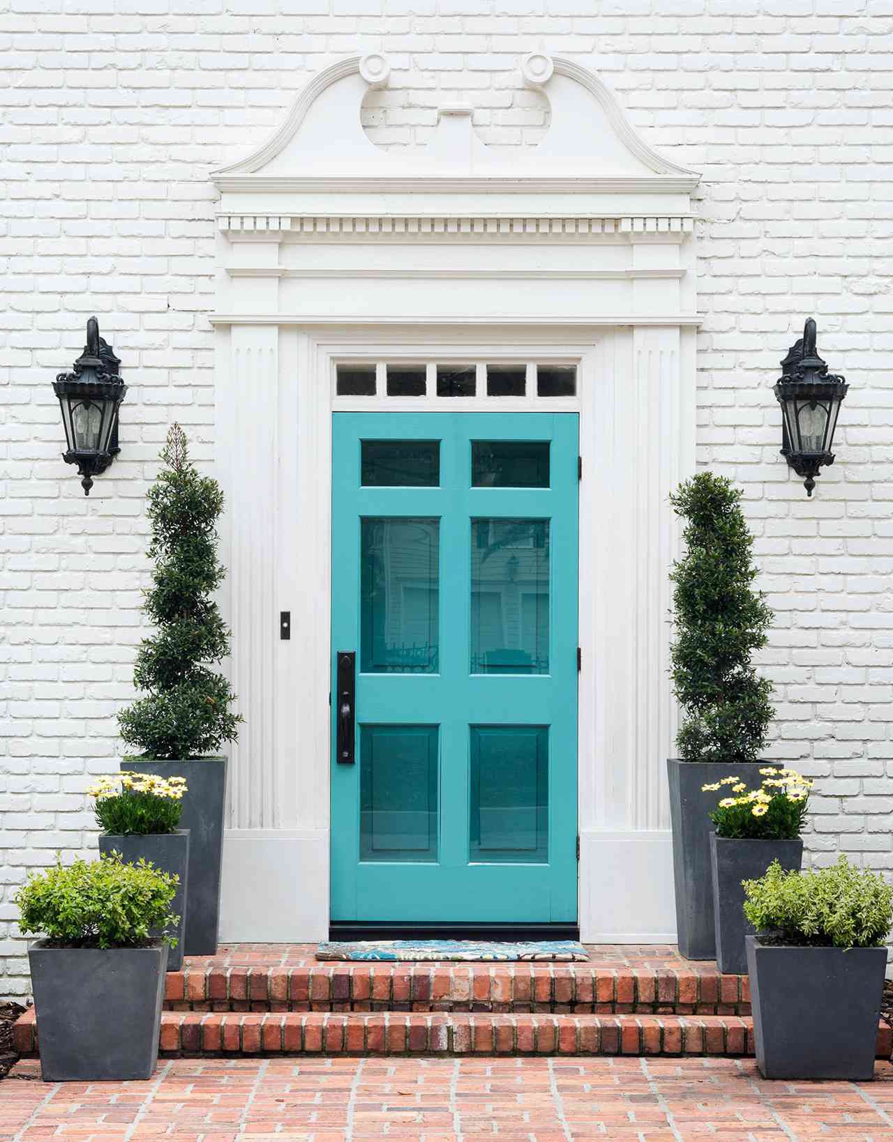 white brick house exterior teal front door